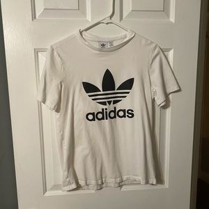 woman’s white adidas tee shirt